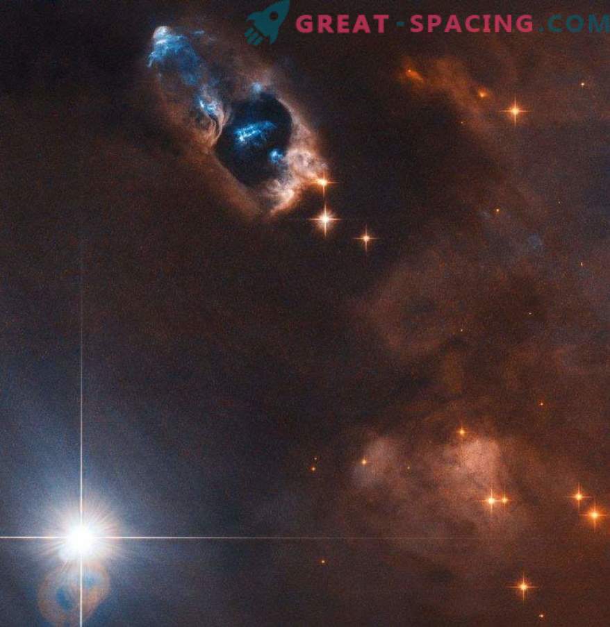 Teleskop Hubble'a przechwytuje obiekty gazowe w pobliżu nowonarodzonej gwiazdy